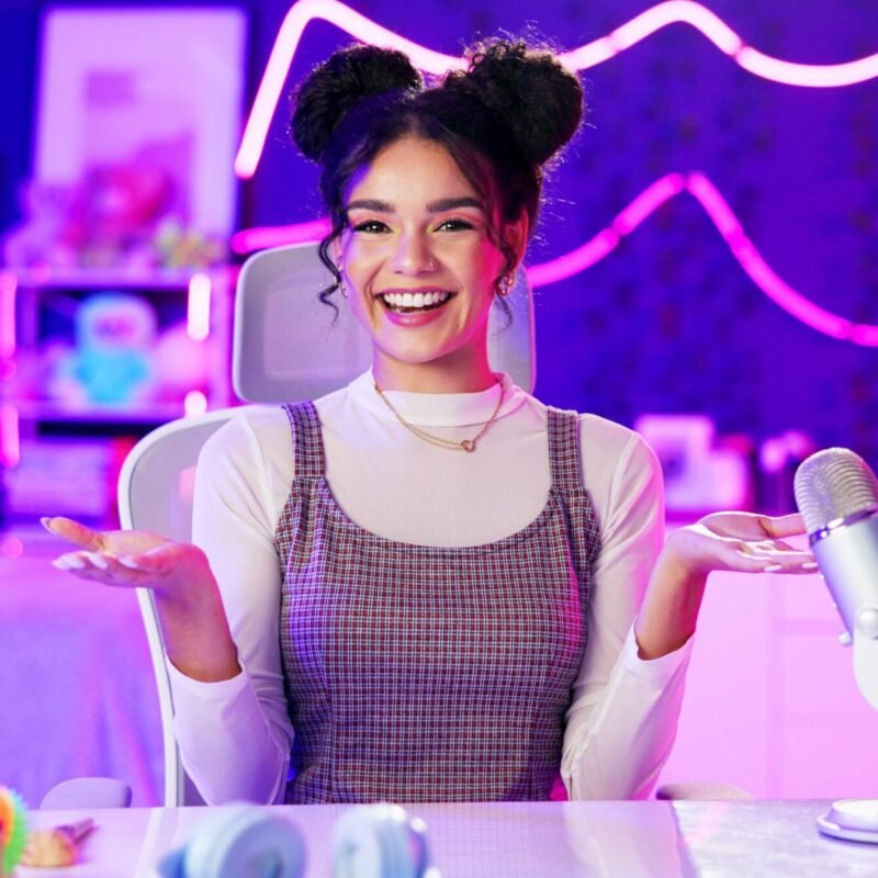 Influencer, neon and portrait of girl with microphone for podcast, live streaming and radio broadca.