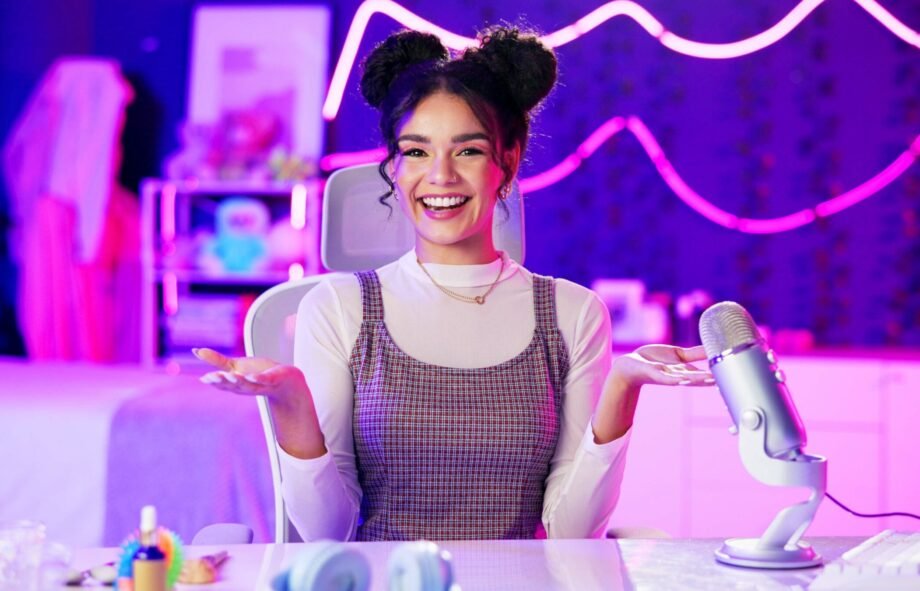 Influencer, neon and portrait of girl with microphone for podcast, live streaming and radio broadca.